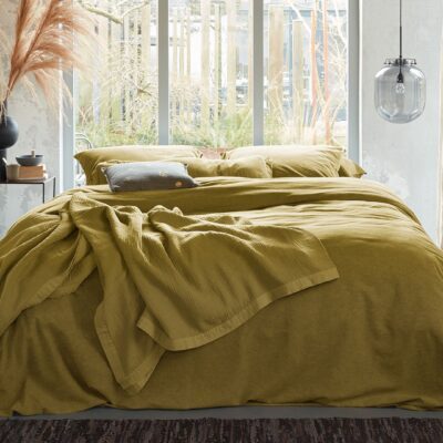 Trendkleur okergeel: warmte in je slaapkamer