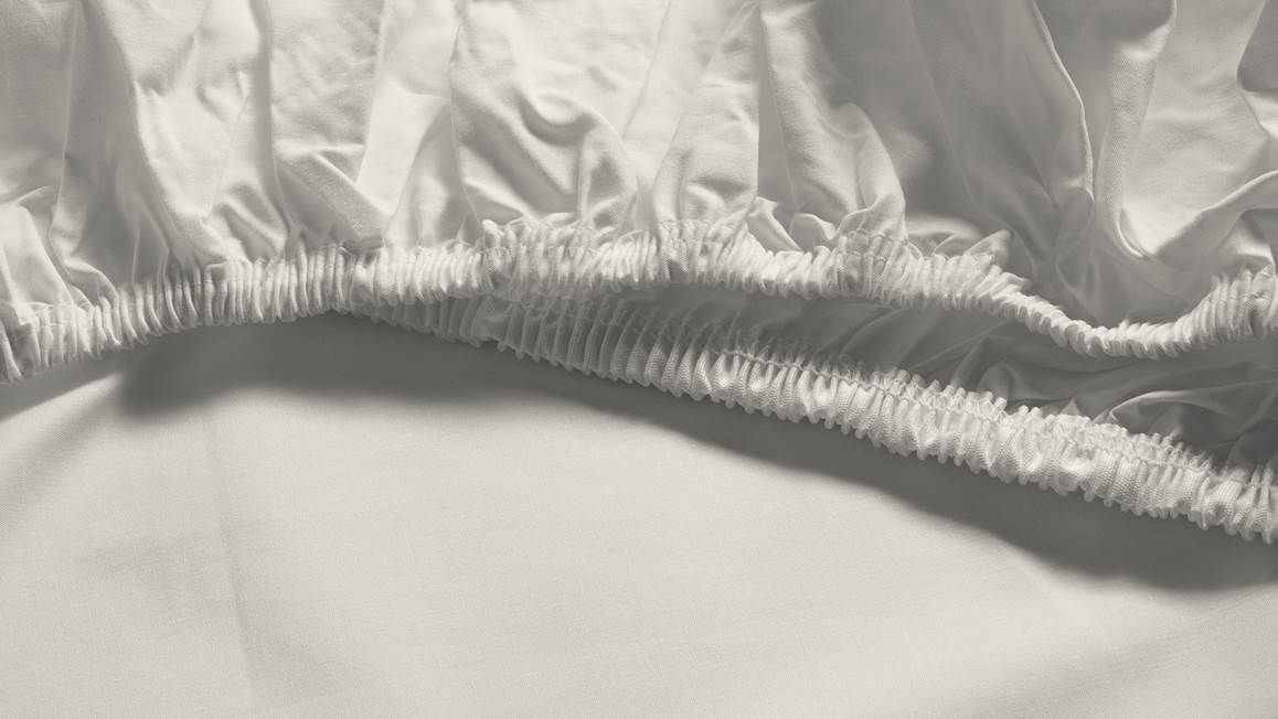 Snoozing percale katoen topper hoeslaken